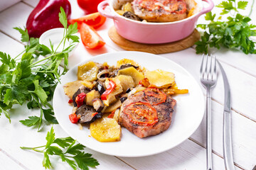 Beef steak with vegetables on a white plate. Grilled beef steak on a white plate for lunch. Close-up