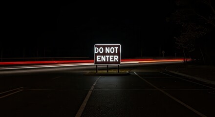 Do Not Enter Sign with Motion Blurred Lights at Night
