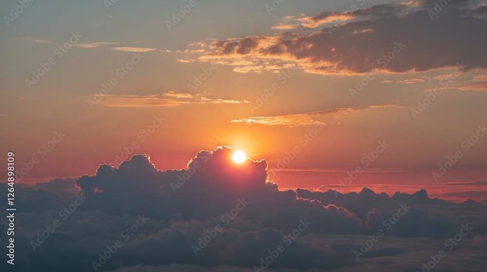 Aufkleber sunrise over clouds with vibrant orange and blue sky featuring sun partially hidden behind clouds an