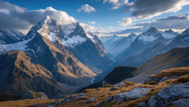 Stunning panoramic view of majestic mountains with snow-capped peaks and a valley under a cloudy sky Copy Space - Powered by Adobe