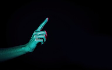 Human Hand Gesturing, Teal and Pink Lighting, Black Background