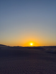 Sunset at the white sands desert also known as Sugar Dunes in Sultanate of Oman