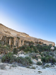 Canyon of Wadi Ash Shuwaymiyyah with unique stalactites in Oman