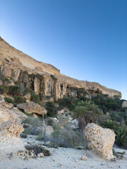 Canyon of Wadi Ash Shuwaymiyyah with unique stalactites in Oman