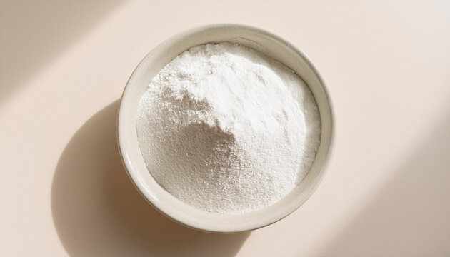 White zinc oxide powder in bowl. Chemistry and medicine concept. Flat lay. Close-up.