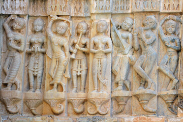 Female musicians are carved into stone on the wall of the Hindu Jagdish temple in Udaipur, India.