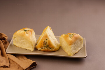 Triangle Garlic Bread Filled With Cheese, Ham and Corn. 