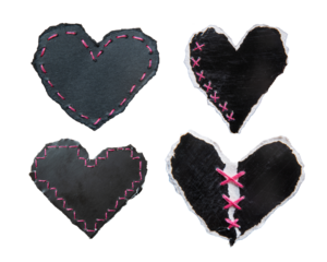 Black heart-shaped torn papers with pink stitches