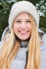 blonde woman outside in the park cosy