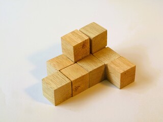 Isometric arranged wooden cube puzzle for logical game isolated white background. Solving logical problems. preschool cognitive learning toys, counting the cube challenge