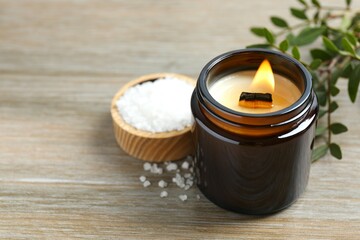 Handmade scented candle in a glass. Soy wax candle with a wooden wick