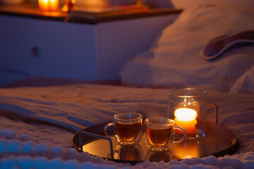 cup of tea in bedroom at night