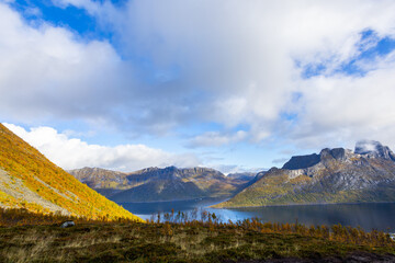 Fototapeta premium Stunning autumn landscape of Segla Mountain in Senja Island, Northern Norway, with dramatic cliffs and fjords.
