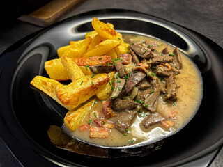 Hearty Meat Dish with Roasted Potatoes & Sauce