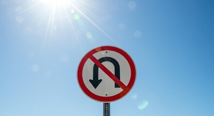No U-turn Traffic Sign Against a Clear Blue Sky and Sun