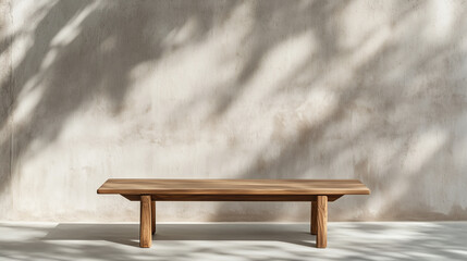 Minimalist wooden bench against textured wall