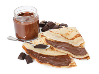 Tasty crepes with chocolate butter and pieces of chocolate isolated on white