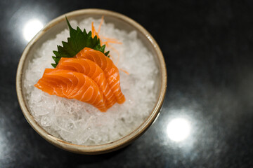 Delicious sashimi salmon on ice. Salmon Sashimi in Japanese buffet restaurant menu