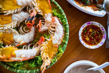 Large river prawns with firm meat are grilled on a charcoal stove. The head of the shrimp is greasy on plates
