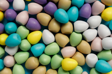 small colorful easter eggs on blue background