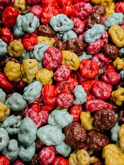 Colorful popcorn mixes create a vibrant display perfect for parties or snack time