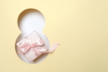 8 March greeting card design with gift box, top view. Happy International Women's Day