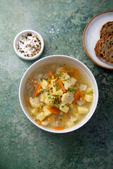 Homemade clear soup with cauliflower