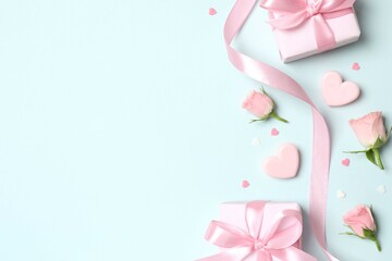Beautiful composition with pink roses and gift boxes on color background