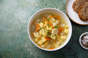 Homemade clear soup with cauliflower