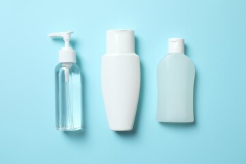Natural cosmetic products on a blue background, top view