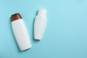 Natural cosmetic products on a blue background, top view
