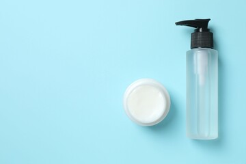 Natural cosmetic products on a blue background, top view