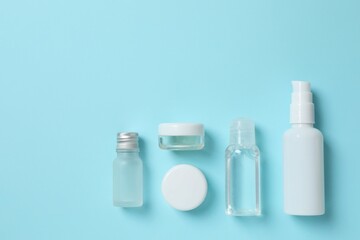 Natural cosmetic products on a blue background, top view