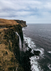 Spectacular Moher Cliffs overlooking the Atlantic Ocean on a cloudy day in Scotland