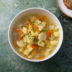 Homemade clear soup with cauliflower