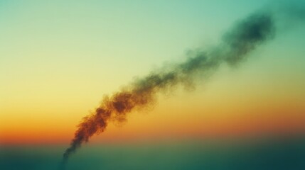 Naklejka premium A sleek plume of dark smoke contrasts against a gradient sunset sky, embodying mystery and transition at twilight.