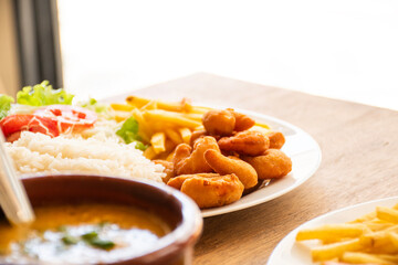 lunch with a dish made in a popular Brazilian seafood restaurant with breaded shrimp
