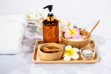 Spa wellness set with natural skincare ingredients, honey, salt, and essential oil