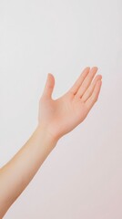 A hand is extended with fingers slightly spread, reaching out in a gesture of openness. The background is simple and light, creating a serene atmosphere that emphasizes the gesture