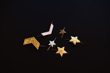 Military Rank Insignia and Badges on Black Background
