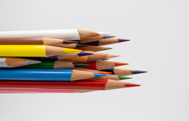 Useful office supplies such as colorful pencils and coloring
