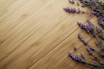 Obraz premium Lavender sprigs arranged on light brown bamboo wood background.