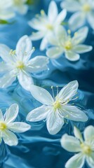 Delicate spring flowers float effortlessly on a vivid blue surface, creating a serene atmosphere. Their white petals radiate purity, harmonizing with the calming ripples of water