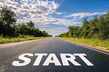 Start line on an empty asphalt road stretching into the horizon, surrounded by lush greenery under a  blue sky with scattered clouds