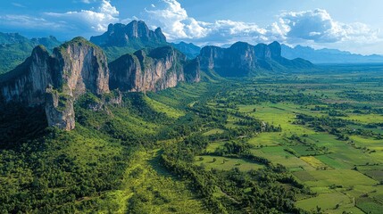 Mountain valley landscape, lush green valley, dramatic cliffs, scenic view, aerial view