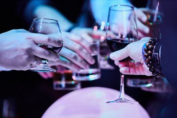 Guests with Glasses of Cocktails at a celebration

