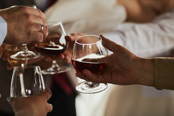 Guests with Glasses of Cocktails at a celebration
