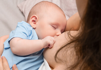 mother breastfeeding her newborn baby, close up