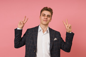 manager in business suit and white shirt looking at camera smiling and showing peace sign