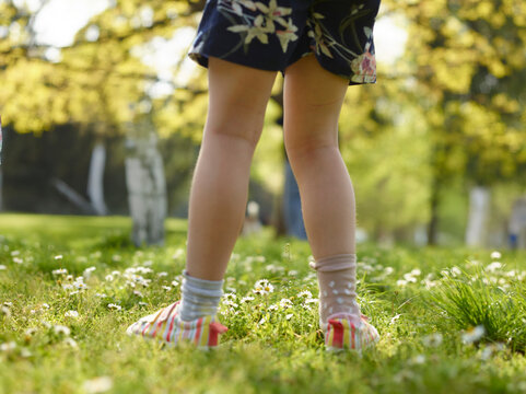 young girl walking in the park